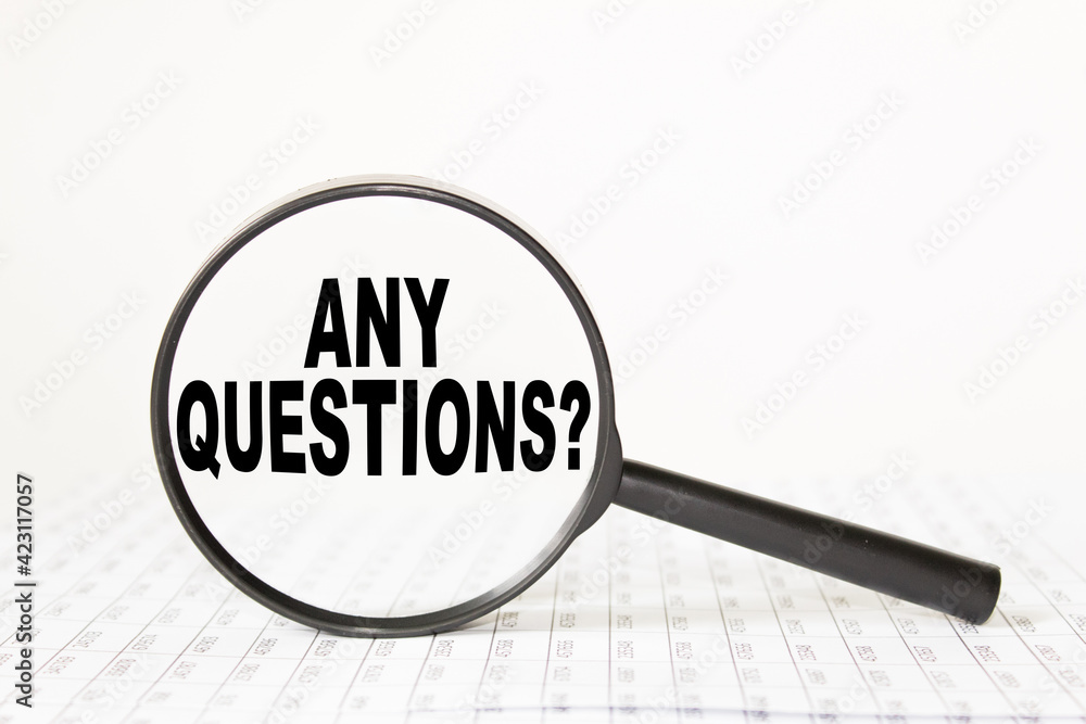 words ANY QUESTIONS in a magnifying glass on a white background. business concept words ANY QUESTIONS in a magnifying glass on a white background. business concept
