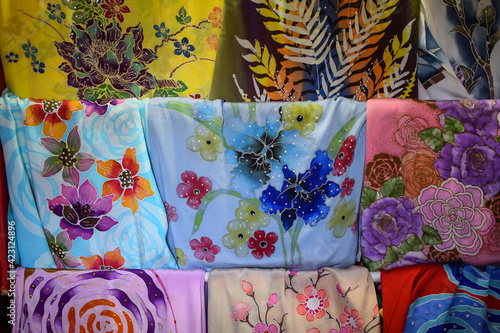 Selection of Malaysia batik in silk fabric on display in Pasar Payang, Kuala Terengganu, Malaysia. photo