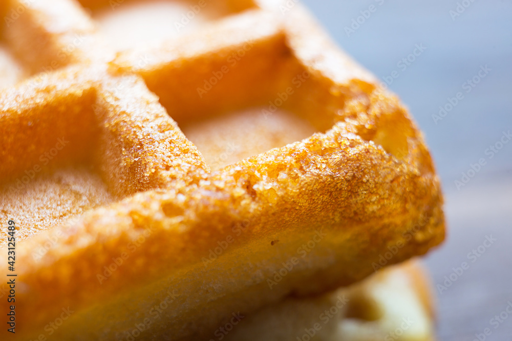 Viennese waffles close-up. Large cage and baking texture - culinary background. Viennese waffles close-up. Large cage and baking texture - culinary background.