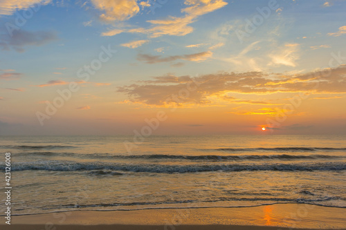 Pictures of sandy beach, sea and evening sunset view with blue sky, beautiful twilight.