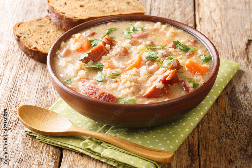 Delicious ricet dish barley and bean with meat and vegetables close-up in a bowl on the table. horizontal Delicious ricet dish barley and bean with meat and vegetables close-up in a bowl on the table. horizontal