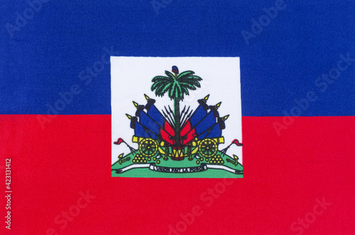 Obraz na plátně national flag of the Republic of Haiti on a fabric base close-up