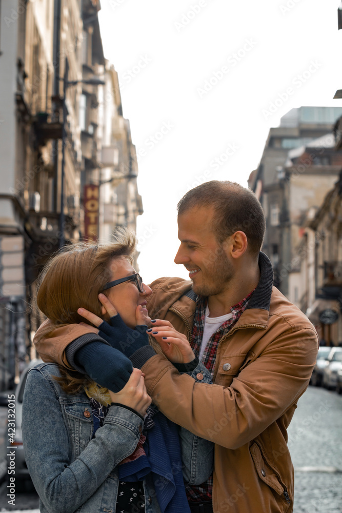 Young couple enjoying on the urban streets. Young couple enjoying on the urban streets.