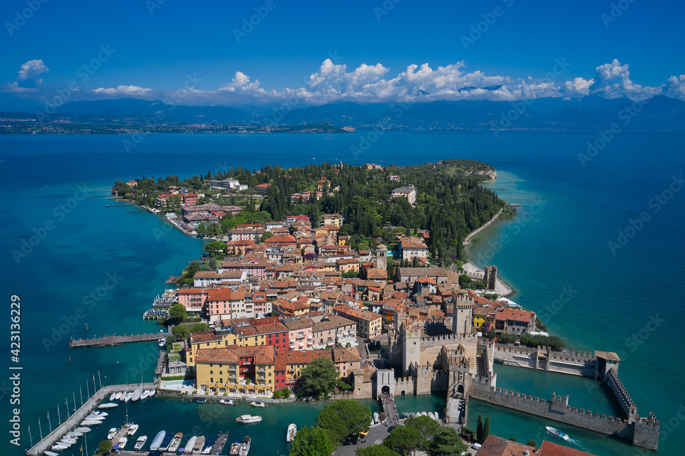Aerial view on Sirmione sul Garda. Italy, Lombardy. Rocca Scaligera Castle in Sirmione. View by Drone.  Scaligero Castle is a fortress in the historical center of Sirmione town