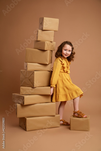 Girl holding a high pile of gifts