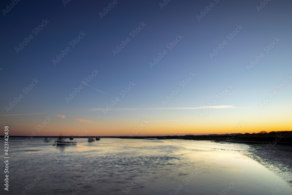 The River Alde at sunset in Orford, Suffolk, UK