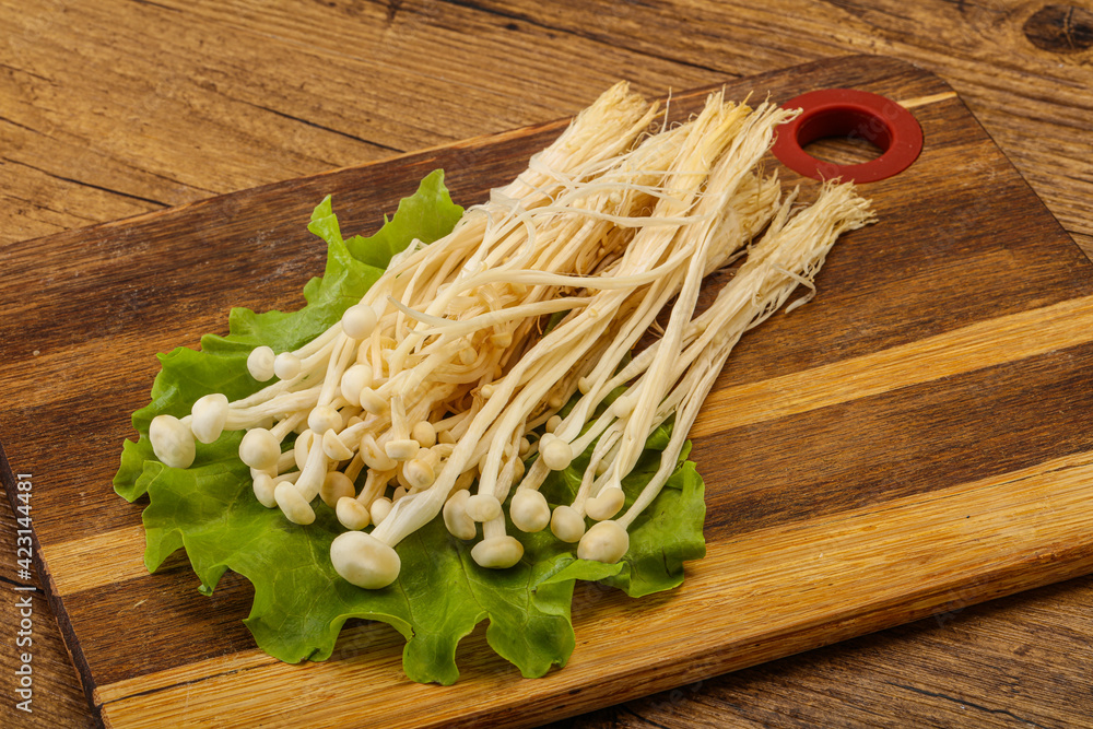 Raw Enoki mushrooms for cooking Raw Enoki mushrooms for cooking