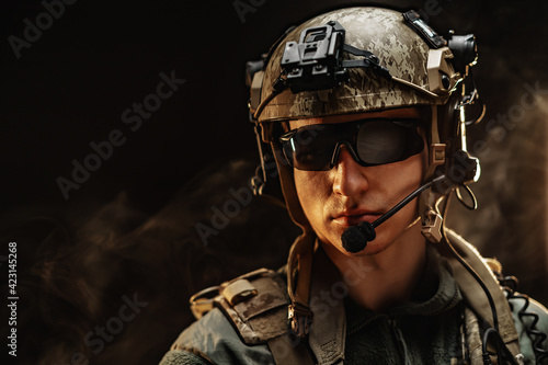 Portrait of special forces soldier in helmet and glasses in the dark © fotofabrika