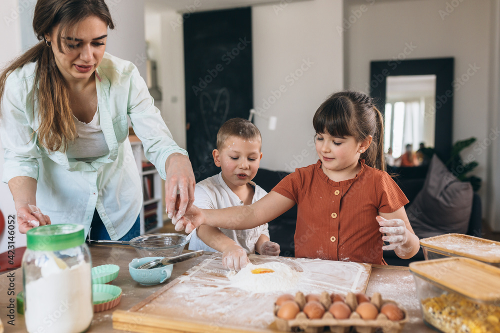 children baking with their mother at home children baking with their mother at home