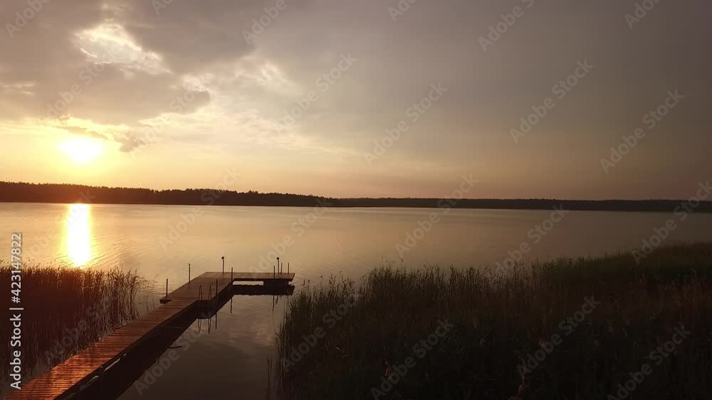 Beautiful drone shot of a sunrise on a peaceful lake in the early morning Beautiful drone shot of a sunrise on a peaceful lake in the early morning