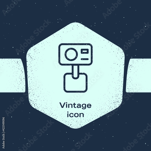 Grunge line Action extreme camera icon isolated on blue background. Video camera equipment for filming extreme sports. Monochrome vintage drawing. Vector
