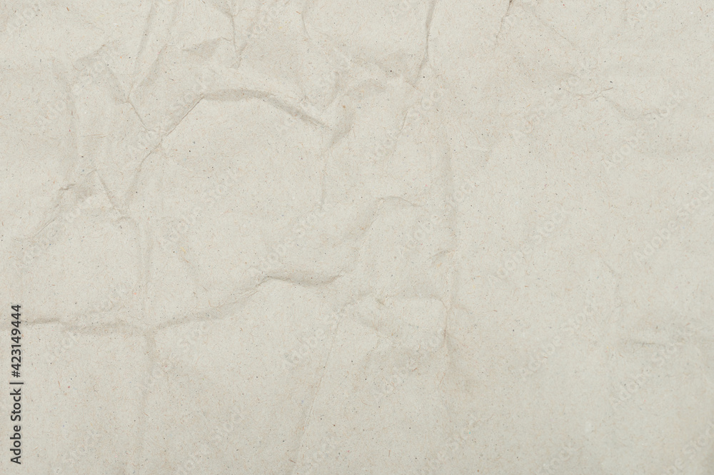 Fototapeta premium Empty crumpled beige color paper surface