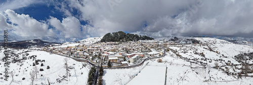 Wallpaper Mural 180 degree aerial shot with drone of the small town of Floresta, the highest town in Sicily, in the heart of the Nebrodi. Winter in Floresta. Snow in Sicily. Sicilian winter. View of the snow-covered  Torontodigital.ca