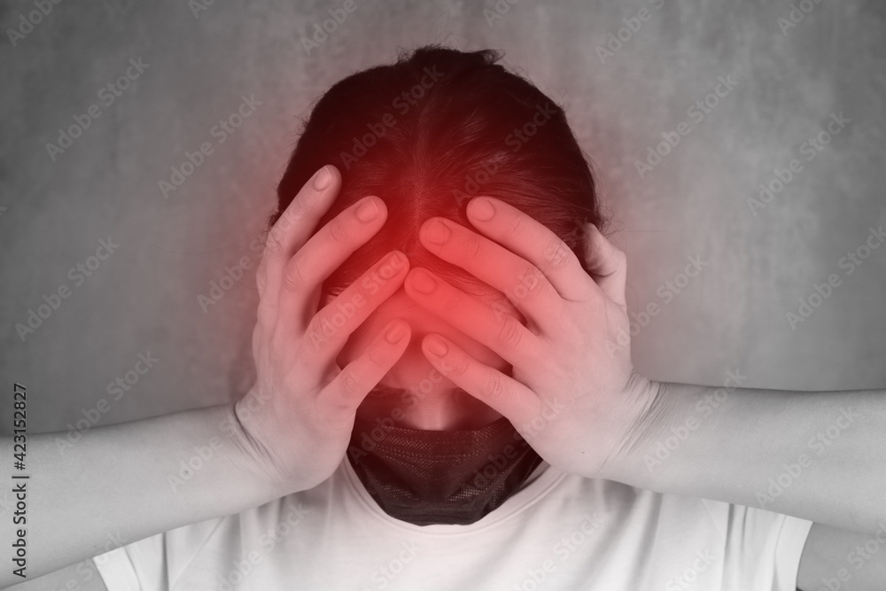 Woman suffers from headache migraine, red pain area on black and white Woman suffers from headache migraine, red pain area on black and white