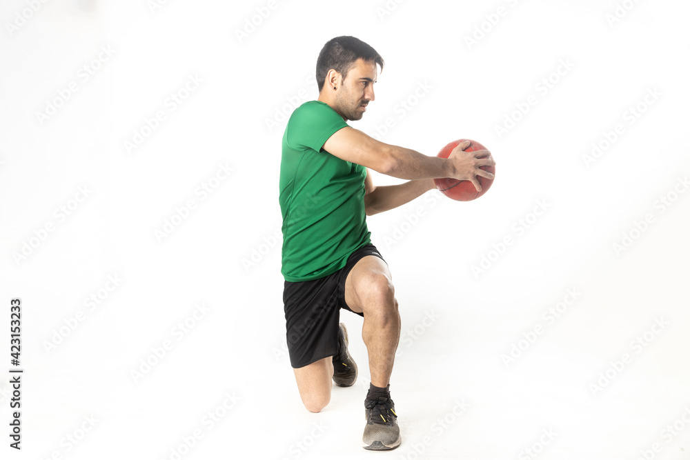 man exercising with medicine ball on white background