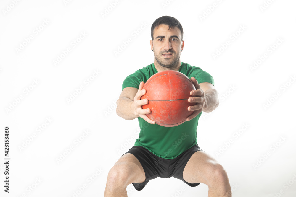 man exercising with medicine ball on white background