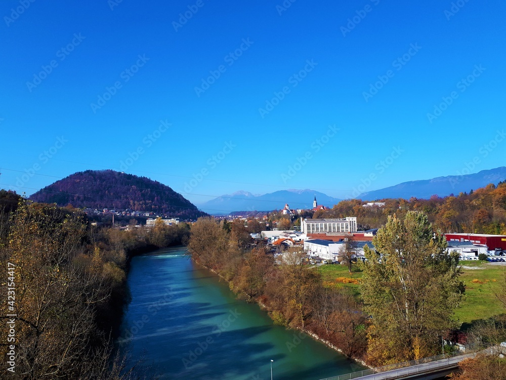 Sava river and the town of Kranj in Gorenjska, Slovenia and an industrial district in front and hill Smarjetna gora in the side