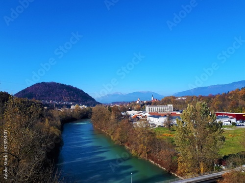 Sava river and the town of Kranj in Gorenjska, Slovenia and an industrial district in front and hill Smarjetna gora in the side