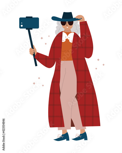 Old lady making selfie with monopod stick.