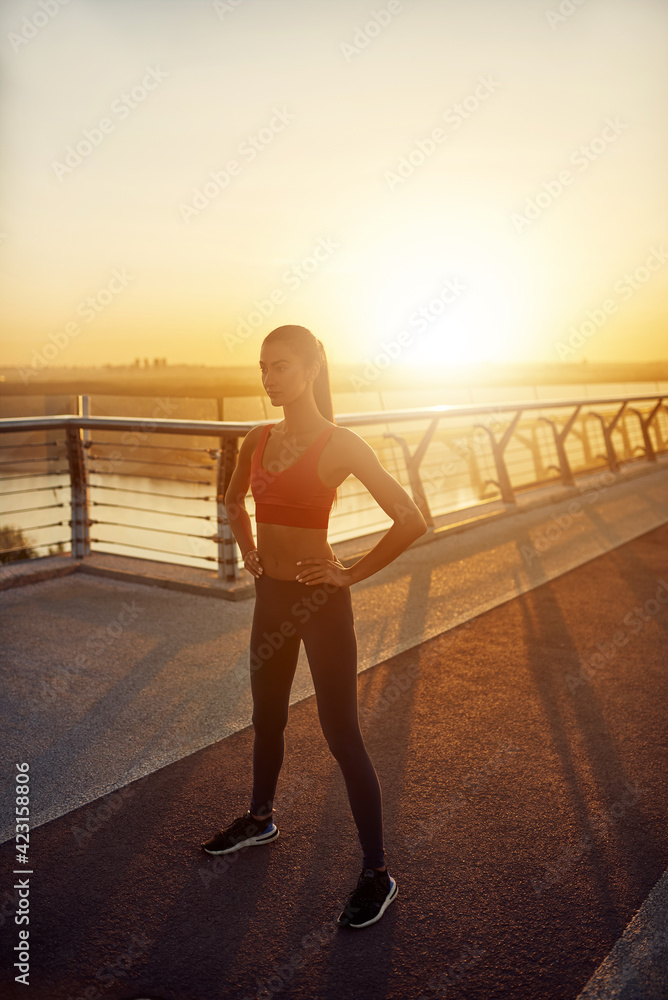 Fototapeta premium Girl doing sport outdoors in the morning