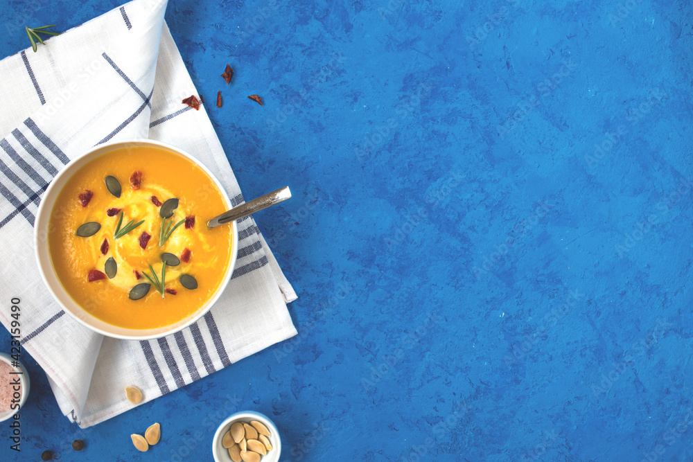 Pumpkin soup on blue background