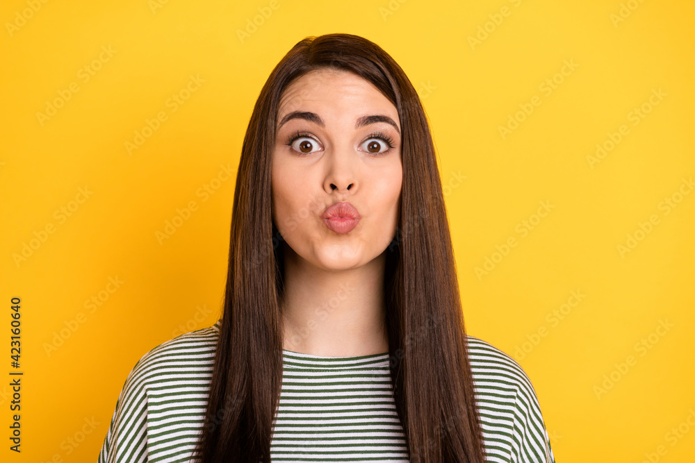 Photo of coquette brunette girlfriend lips blow air kiss look camera wear striped shirt isolated yellow background Photo of coquette brunette girlfriend lips blow air kiss look camera wear striped shirt isolated yellow background