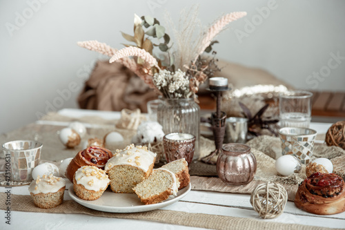 A beautifully set table for Easter with decorative details and pastries.