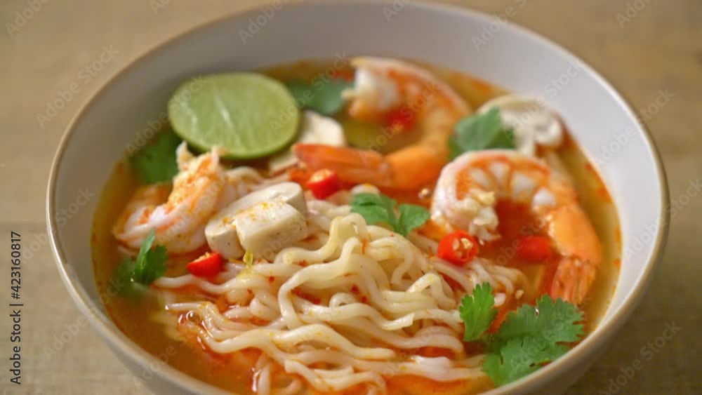 instant noodles ramen in spicy soup with shrimps (Tom Yum Kung) - Asian food style instant noodles ramen in spicy soup with shrimps (Tom Yum Kung) - Asian food style