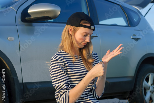 Young Blond Woman with wrench near car © Aikon