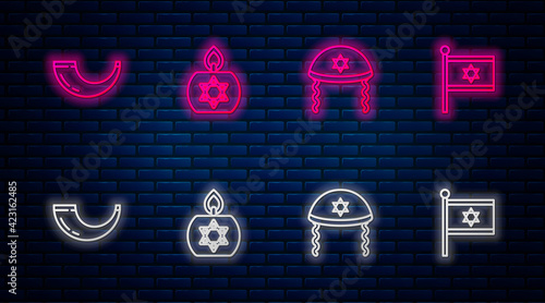 Set line Burning candle, Jewish kippah, Traditional ram horn, shofar and Flag Israel. Glowing neon icon on brick wall. Vector