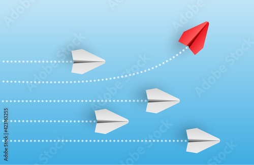 Individuality concept. Individual and unique leader red paper plane flies to the side.