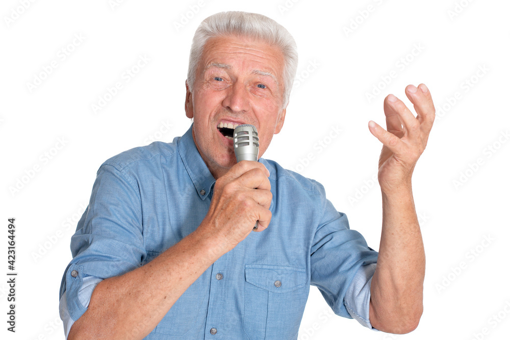 Senior man singing into microphone Senior man singing into microphone