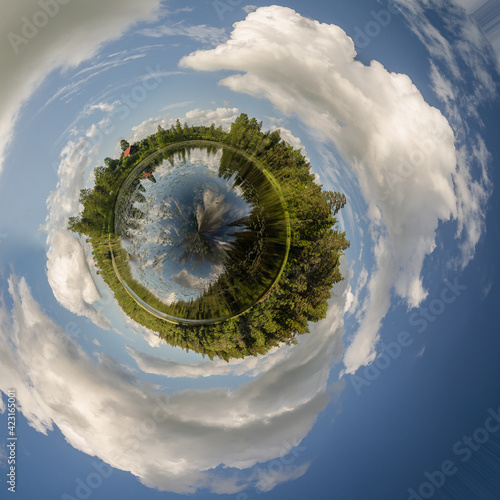 Beautiful green little planet with lake and forest.  photo