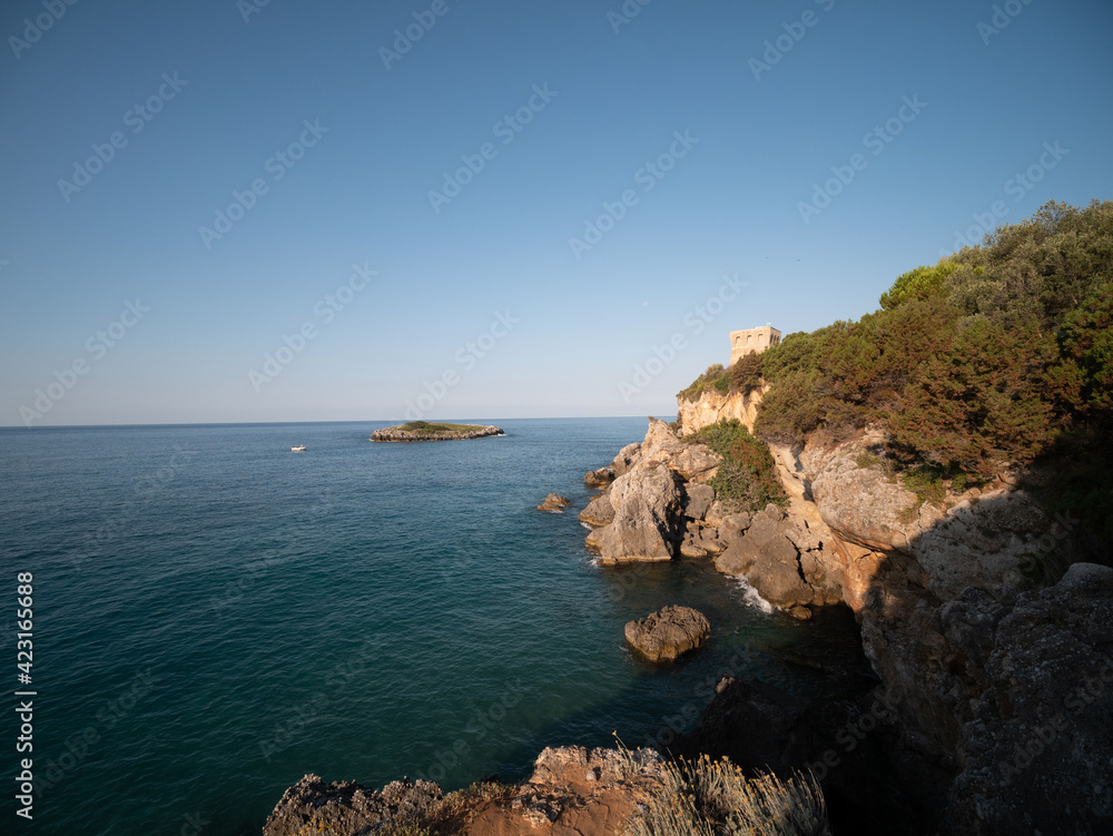 coastal tower and islet on the Tyrrhenian Sea near Marina di Camerota. Cilento, Salerno, Campania, Italy