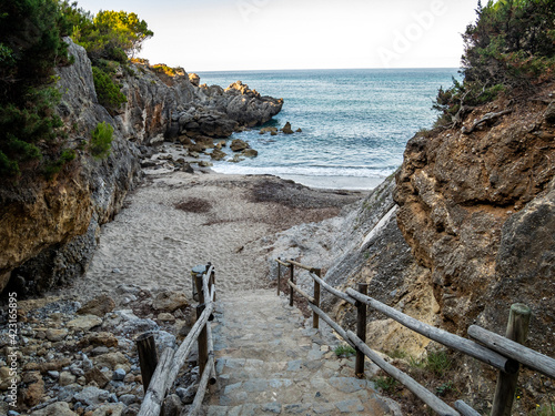 A stairway to the sea. Beautiful cove on the Tyrrhenian sea near Marina di Camerota, Cilento and Vallo di Diano National Park, Salerno, Campania, Italy photo