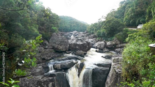 Waterfall in the jungles of Madagascar. Wide shot tilting  photo