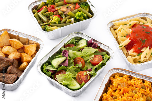 Take away healthy food in foil boxes isolated on white background
