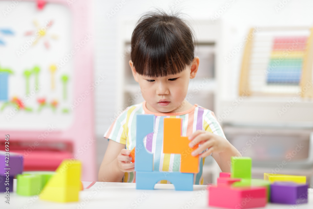 young girl playing creative blocks at home young girl playing creative blocks at home