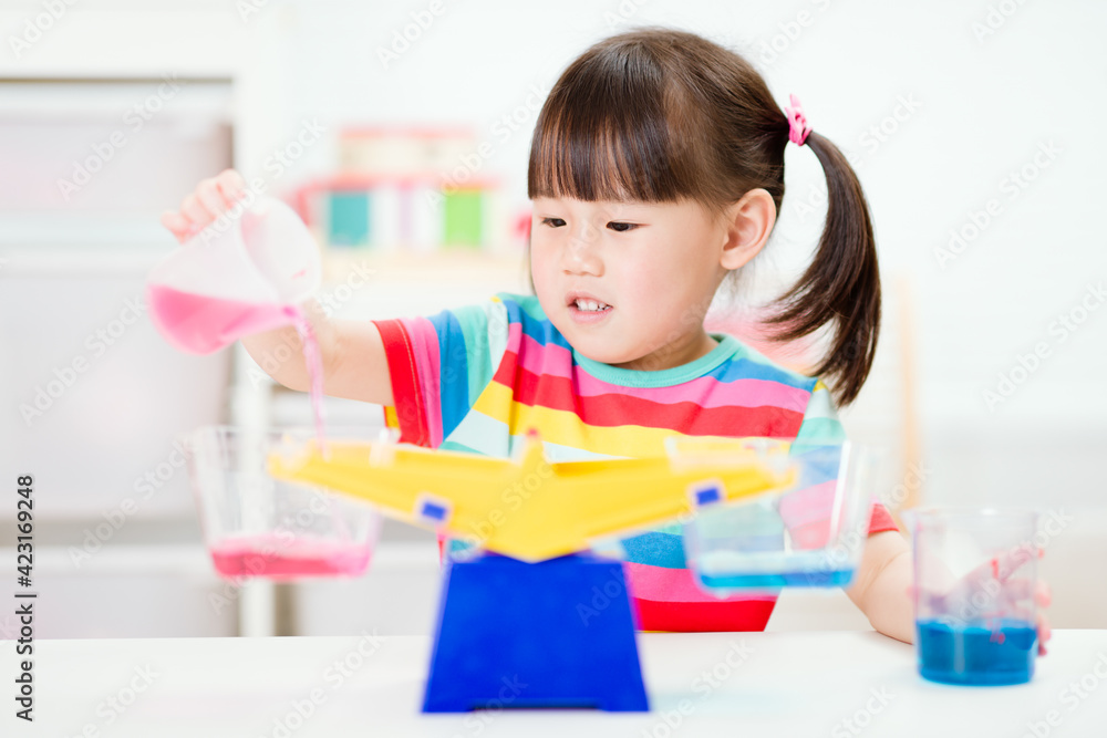young girl play balance toy for homeschooling young girl play balance toy for homeschooling