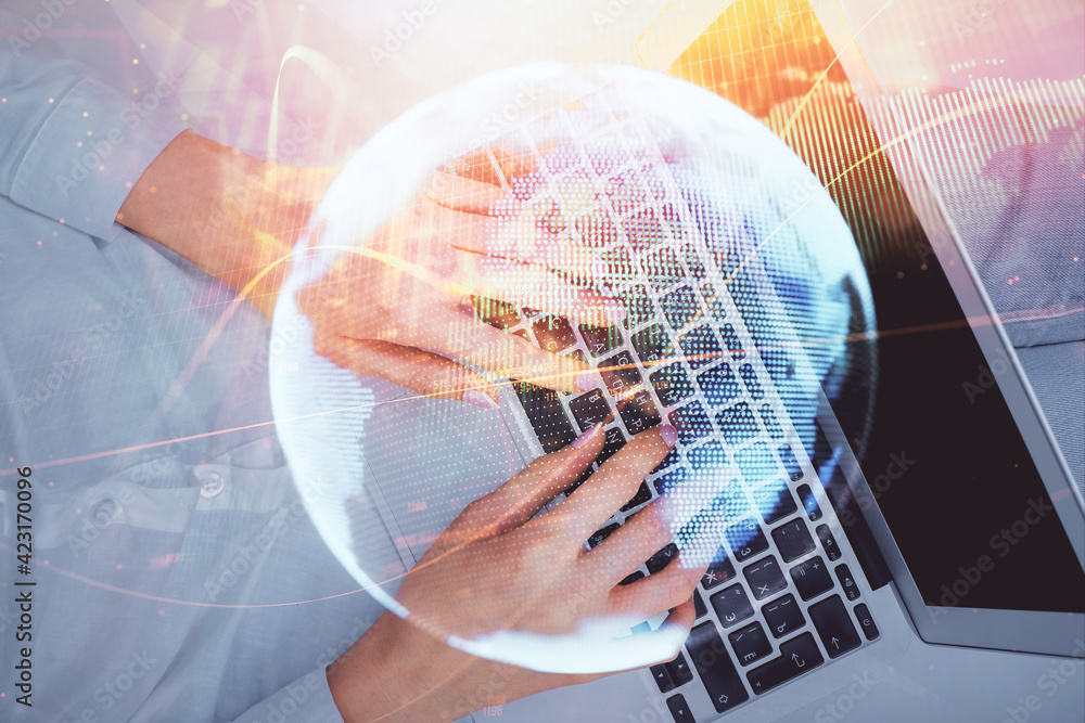 Double exposure of woman hands working on computer and financial theme hologram drawing. Top View. Business concept. Double exposure of woman hands working on computer and financial theme hologram drawing. Top View. Business concept.