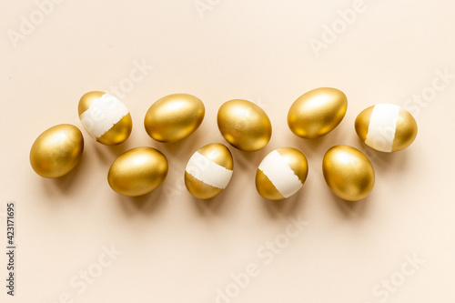 Set of golden eggs. Easter decoration. Wealth and good luck concept. Overhead view