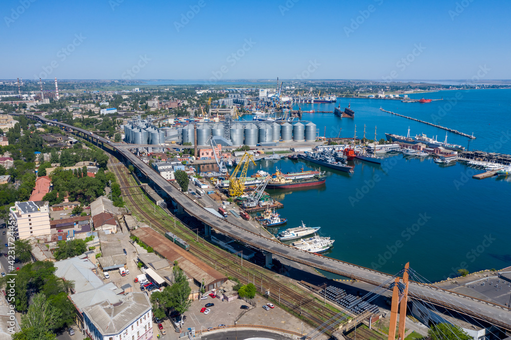 Fototapeta premium Panoramic industrial landscape of marine port and grain elevator terminal. Odessa, Ukraine.