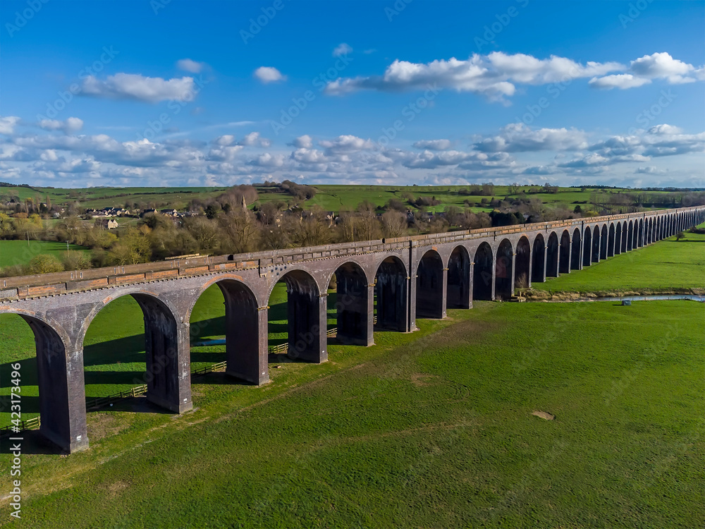 A view across the Welland Valley viaduct towards the village of Harringworth on a bright sunny spring day in the UK