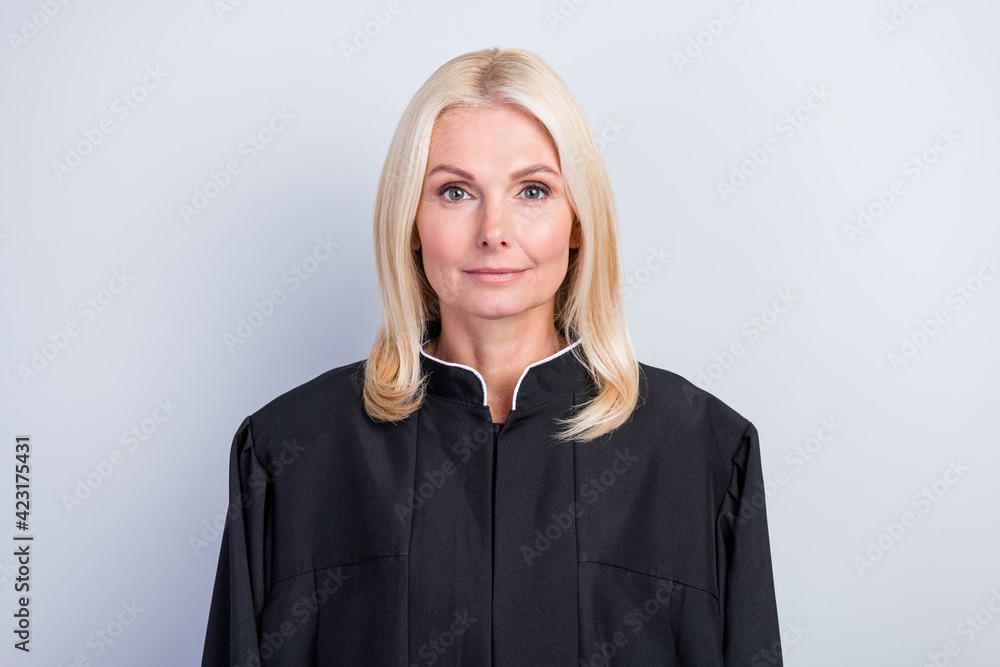 Fototapeta premium Portrait of attractive clever smart woman judge wearing black robe career promotion isolated over grey pastel color background