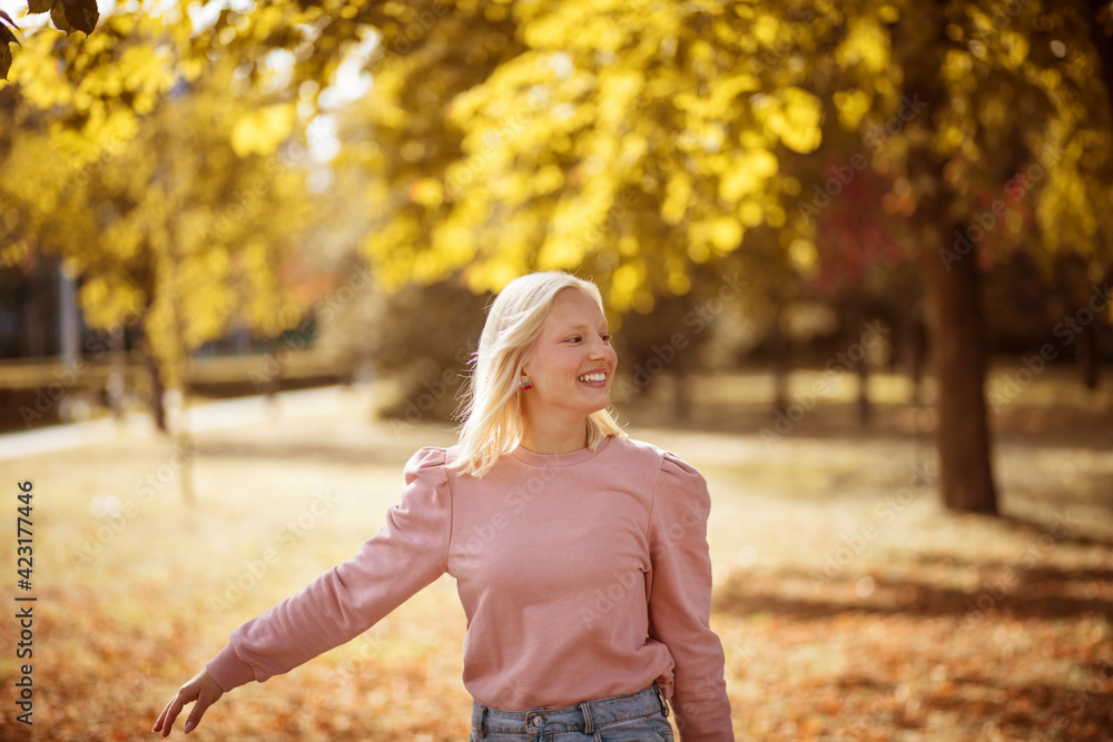 Happy young woman enjoying in the park. Happy young woman enjoying in the park.