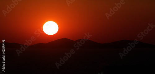 Hot red sunset above mountains 
