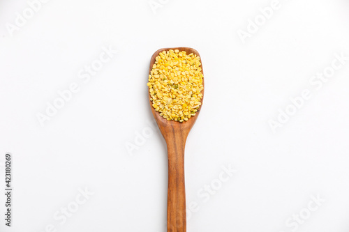 yellow moong mung dal lentil pulse bean on white background.