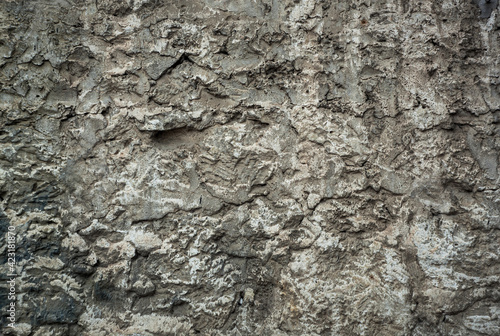 concrete wall with rough smears of cement gray background.
