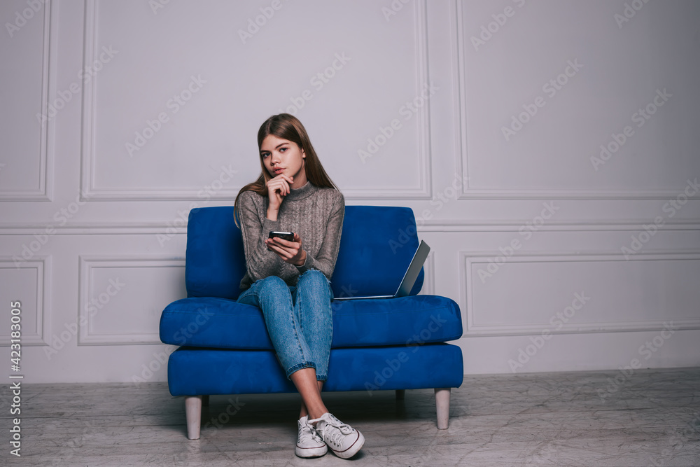 Charming freelancer with smartphone in light room Charming freelancer with smartphone in light room