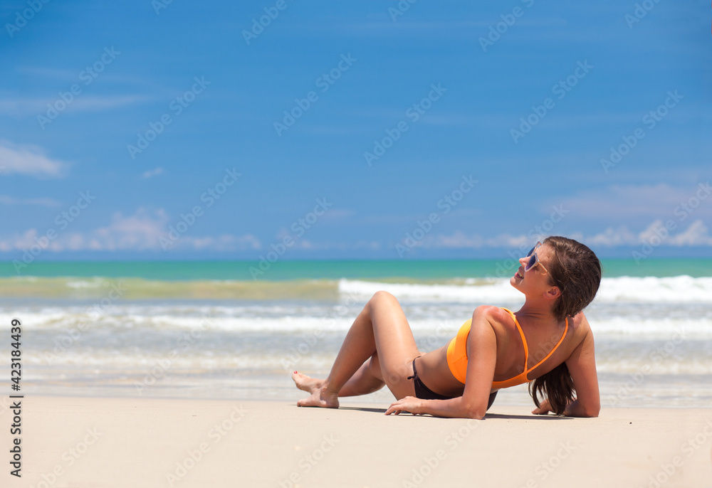 long haired girl in bikini on tropical thai beach
